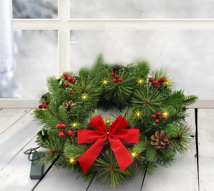 Ghirlanda natalizia a LED
con 15 LED
Decorazione con fiocco rosso
Diametro 40 cm
Altezza 20 cm