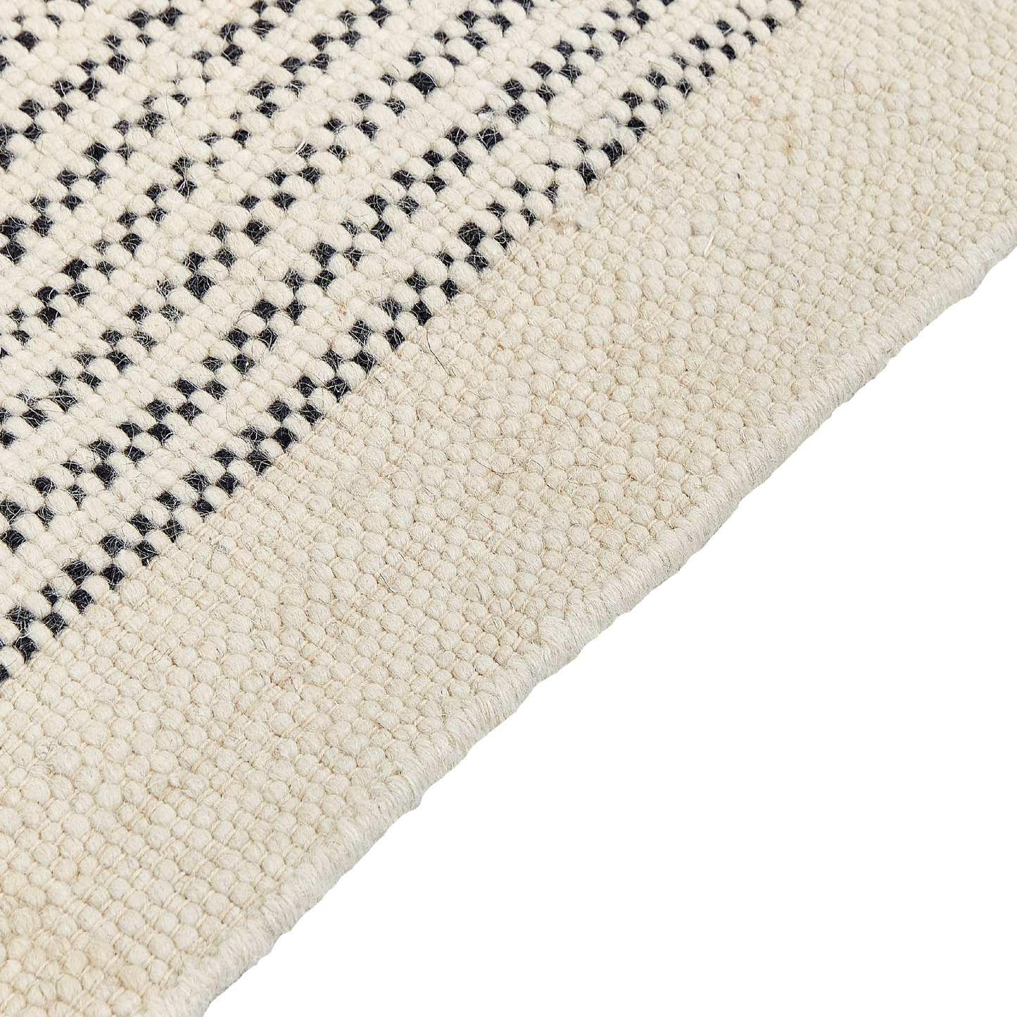 Teppich Wolle beige / schwarz 140 x 200 cm Kurzflor DIVARLI