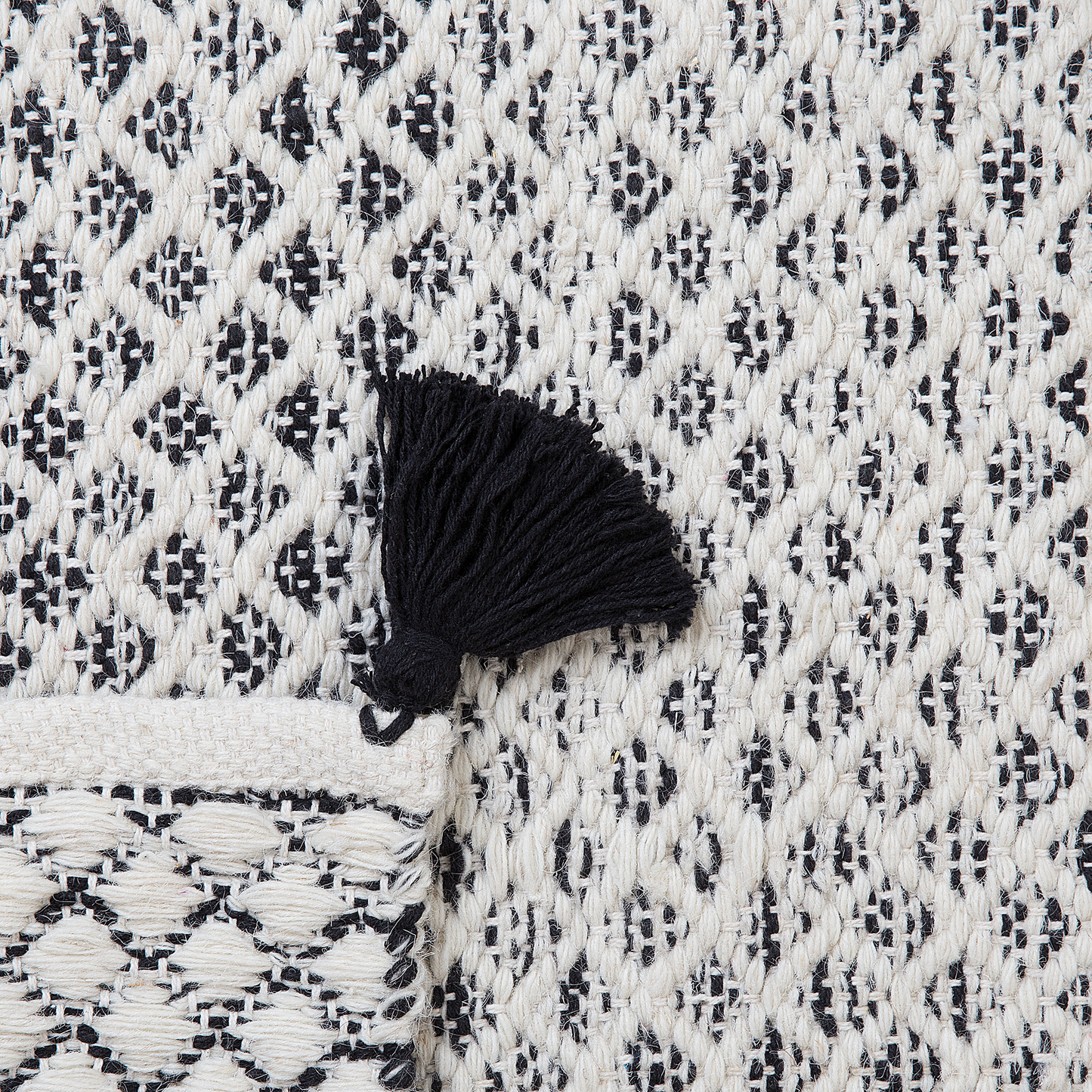 Teppich Wolle schwarz / weiss 80 x 150 cm Kurzflor GEMLIK