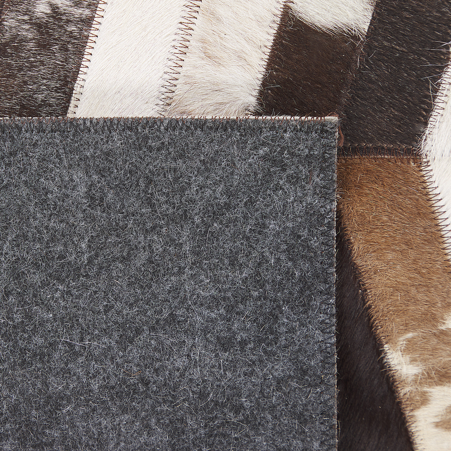 Teppich Kuhfell braun / weiss 140 x 200 cm Patchwork Kurzflor AKYELE