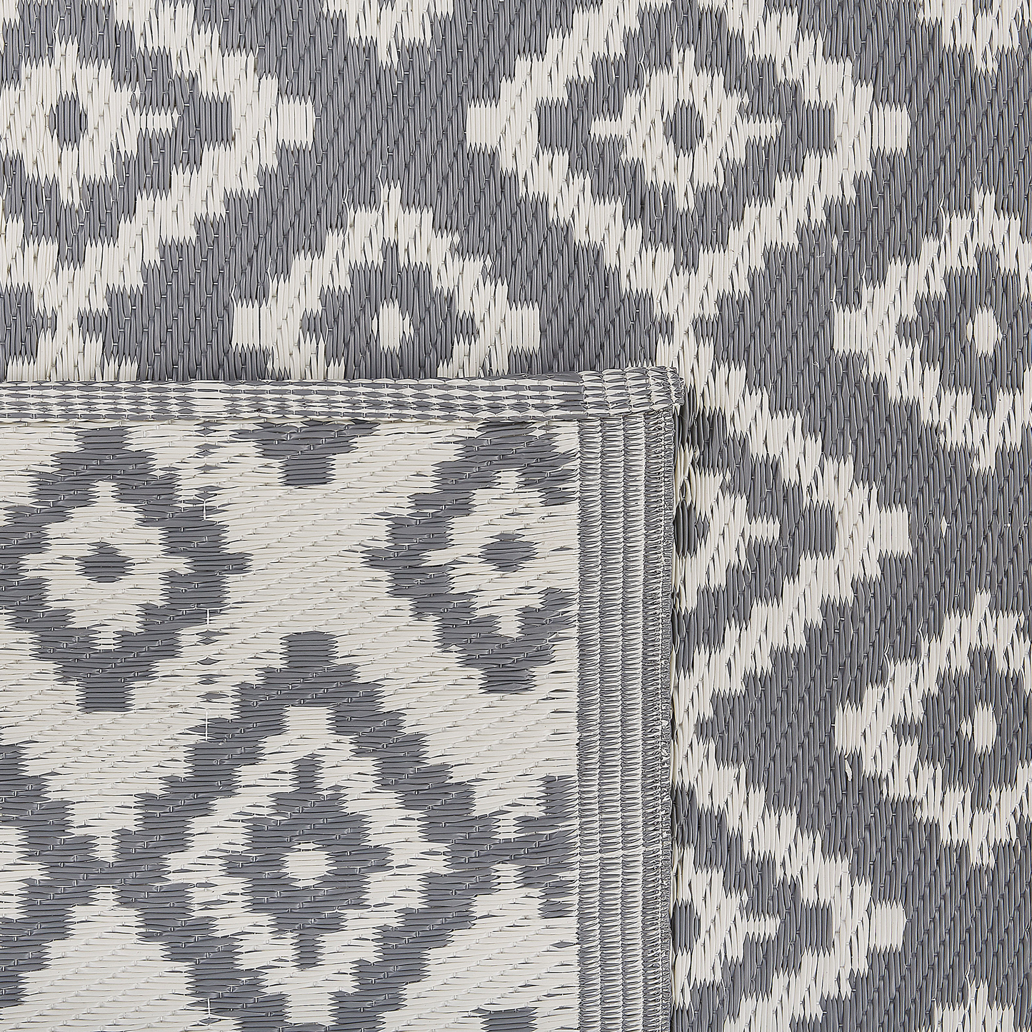 Outdoor Teppich grau 120 x 180 cm geometrisches Muster Kurzflor DHULE