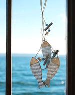 Girlande mit Fisch 
aus Holz L:60cm
mit Muscheln und Kralen