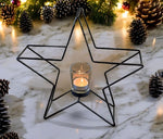 Kerzenhalter Stern 
in Schwarz aus Metall 
H: 28cm B: 29cm T: 8cm
