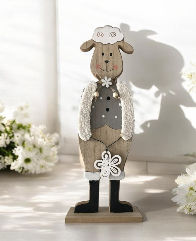 Deko Schaf aus Holz auf Sockel
Farbe: Grau weiss
L:14cm B:5cm H:39cm