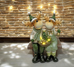 LED Deko Rentier sitzend auf der Bank 3 warm weisse LED