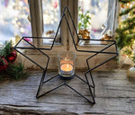 Kerzenhalter Stern 
in Schwarz aus Metall 
H: 28cm B: 29cm T: 8cm