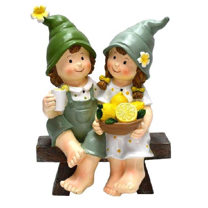 Dekofiguren Kinder sitzend auf Bank mit Zitronen