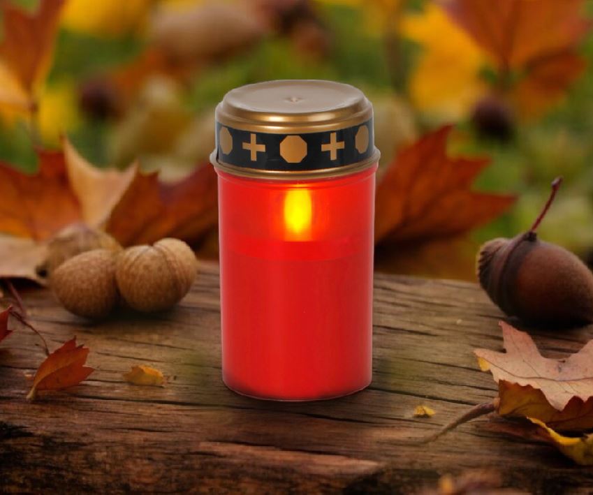 LED Grabkerze rot mit 
Dämmerungsschalter (Sensor)
Grösse: 7.3cm x12cm
12 St im Display