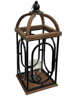 Laterne aus Metall und Holz 
Dunkelbraun Holz 
Schwarz Metall 
mit Hängevorrichtung