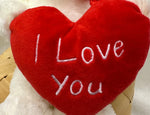 Plüschbär sitzend weiss mit rotem Herzkissen I love you Grösse 22x16x20cm