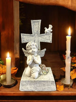Engelfigur sitzend an Kreuz angelehnt H18.5cm