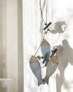 Girlande mit Fisch 
aus Holz L:60cm
mit Muscheln und Kralen