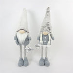 Gnome décoratif Père Noël garçon
 debout Couleur: Blanc / Gris
 L7cm x L17cm x H66cm