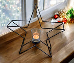 Kerzenhalter Stern 
in Schwarz aus Metall 
H: 28cm B: 29cm T: 8cm