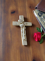 Kreuz aus Polyresin H10.5cm grau verziert mit Blume