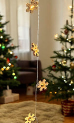 LED Lichterkette mit 10 LED Holz Schneeflocken L:135cm
warm weisses Licht