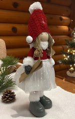 Deko Figur Mädchen stehend 
mit Ski in der Hand H49cm