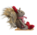 Deko Eichhörnchen auf Schlitten braun weiss mit roter Mütze