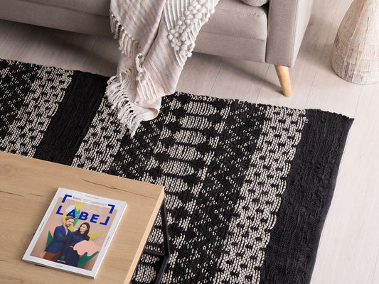 Teppich Leder schwarz / beige 140 x 200 cm abstraktes Muster Kurzflor SOKUN