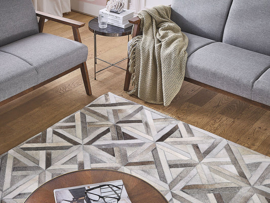 Teppich Kuhfell beige / braun 140 x 200 cm Patchwork Kurzflor TAYTAN