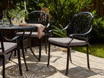 Set mit 4 Stühlen und Sitzkissen ANCONA Metall Schwarz