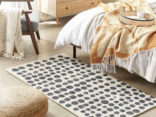 Teppich beige / schwarz 80 x 150 cm gepunktetes Muster HAVRAN