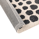 Teppich beige / schwarz 160 x 230 cm gepunktetes Muster HAVRAN