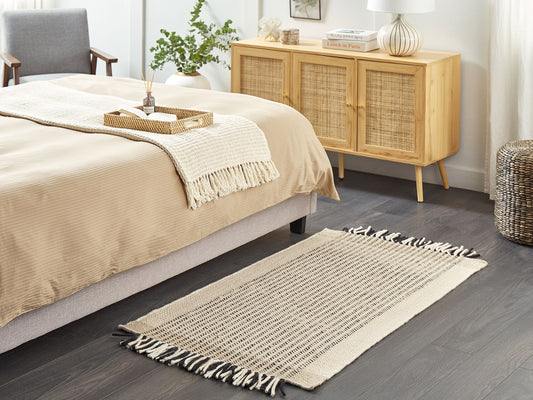 Teppich Wolle beige / schwarz 80 x 150 cm Kurzflor DIVARLI