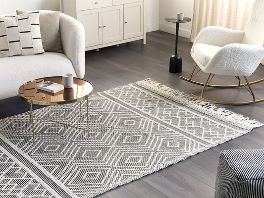 Teppich Wolle schwarz / weiss 160 x 230 cm Fransen Kurzflor SAVUCA