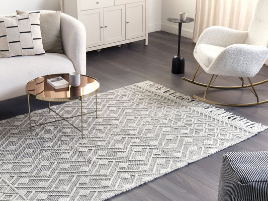 Teppich Wolle schwarz / weiss 160 x 230 cm Fransen Kurzflor KAVAK